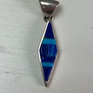 Pd9. Sterling Silver pendant with dark blue and light blue stones.